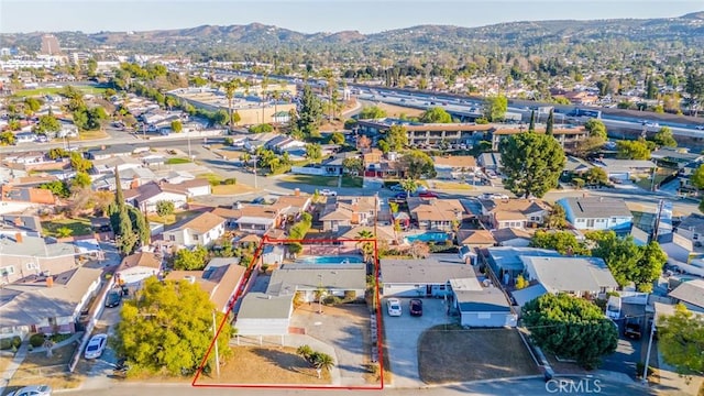 birds eye view of property featuring a mountain view