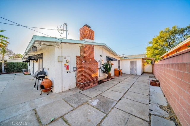 view of property exterior featuring a patio