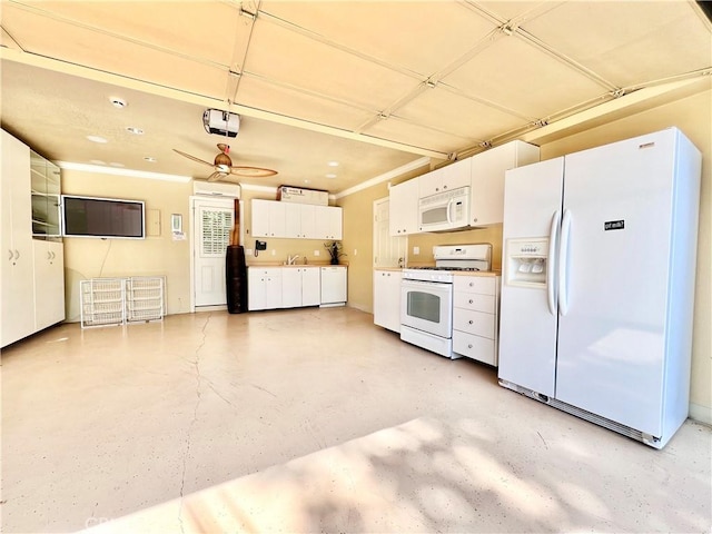 kitchen with sink, white appliances, ceiling fan, white cabinets, and concrete floors