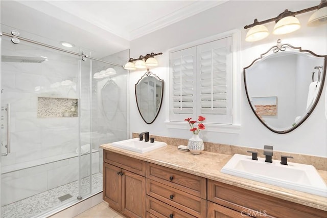 bathroom with tile patterned flooring, ornamental molding, an enclosed shower, and vanity