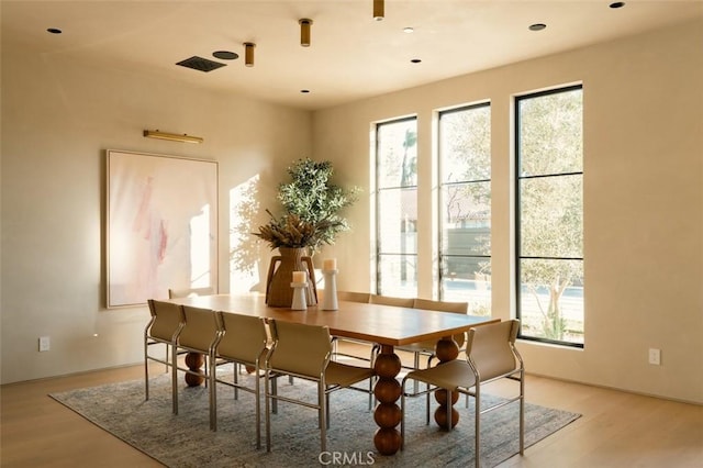 dining area with light hardwood / wood-style floors