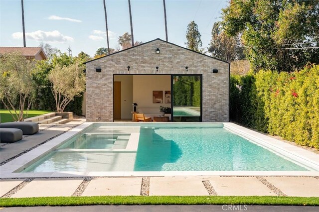 19845 Santa Rita St, Woodland Hills, CA 91364 - pool featuring an outdoor structure, a patio area, and a storage structure