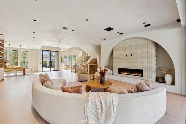 19845 Santa Rita St, Woodland Hills, CA 91364 - living room featuring stairway, a large fireplace, wood finished floors, and recessed lighting