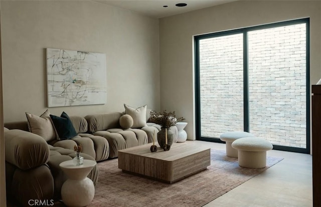 living room featuring finished concrete flooring