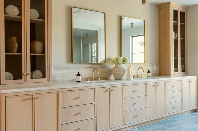 bathroom with vanity and backsplash