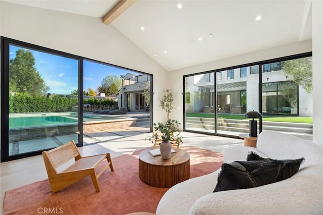 living room featuring high vaulted ceiling and beam ceiling