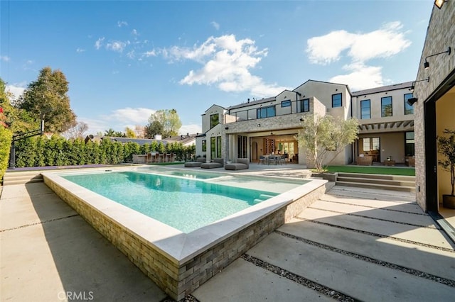 view of pool featuring a fenced in pool and a patio area