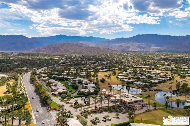 bird's eye view with a water and mountain view