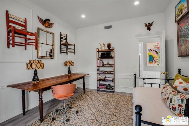 office with hardwood / wood-style flooring