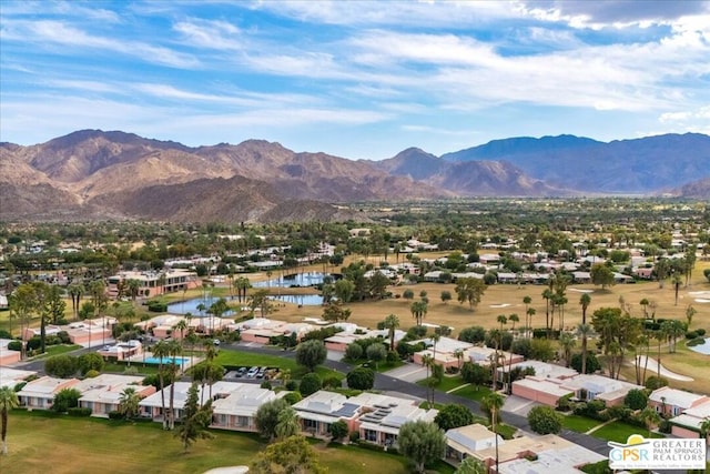 bird's eye view featuring a water and mountain view