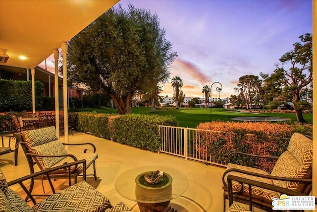 view of patio terrace at dusk