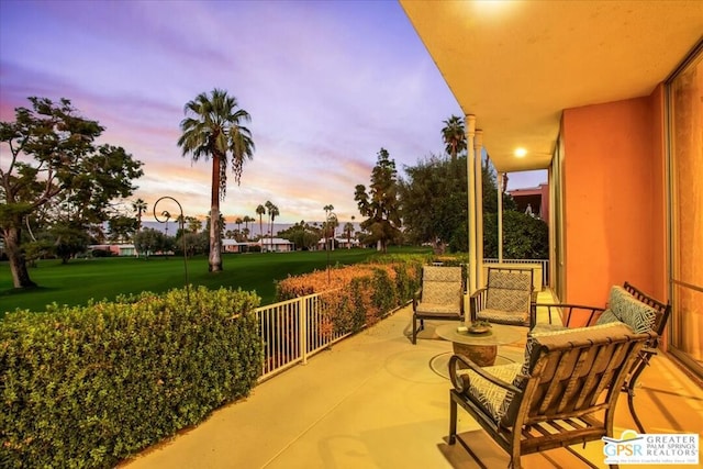 patio terrace at dusk with a yard