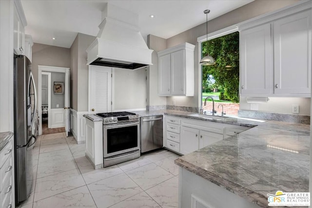 kitchen featuring pendant lighting, sink, white cabinetry, stainless steel appliances, and custom exhaust hood