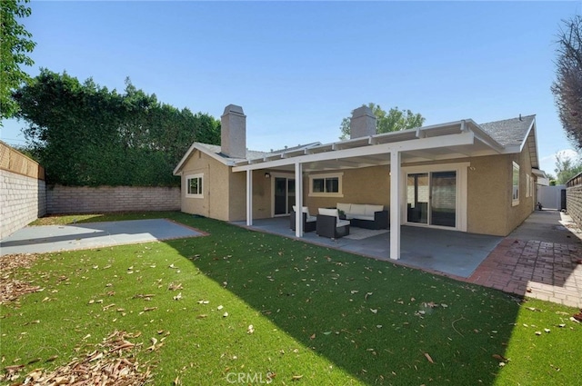 rear view of house featuring an outdoor hangout area, a lawn, and a patio area