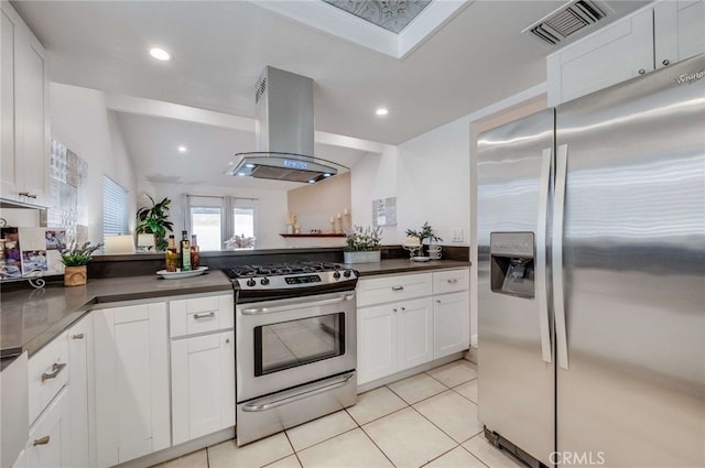 kitchen featuring stainless steel appliances, island exhaust hood, and white cabinetry