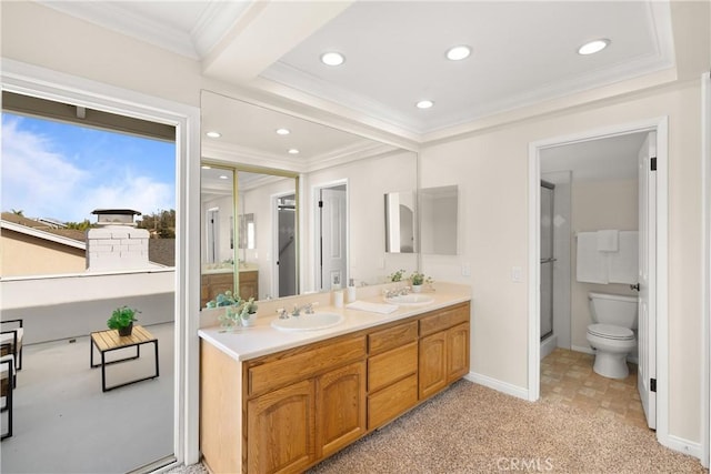 bathroom featuring crown molding, a shower with shower door, vanity, and toilet