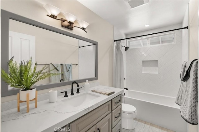 full bathroom with vanity, toilet, and shower / bath combo with shower curtain