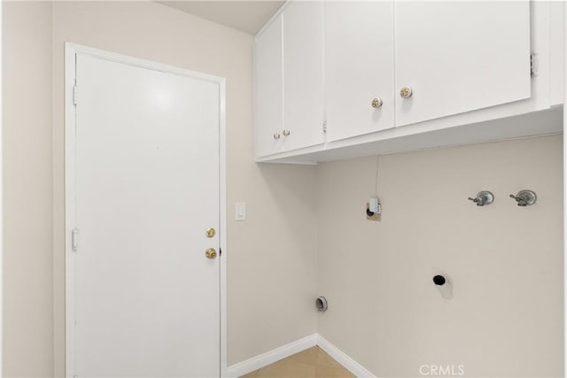 laundry room with cabinets and hookup for an electric dryer