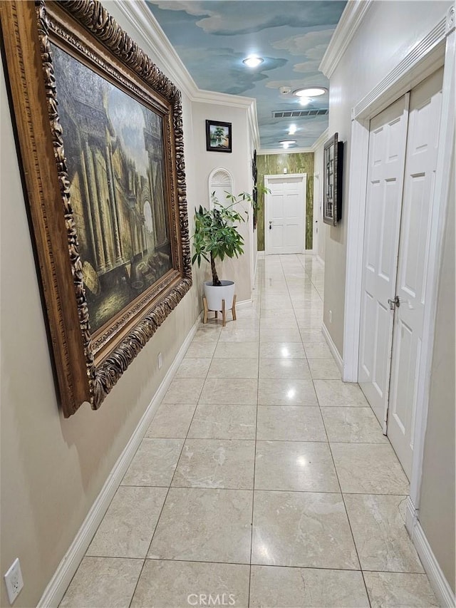 corridor with ornamental molding and light tile patterned floors