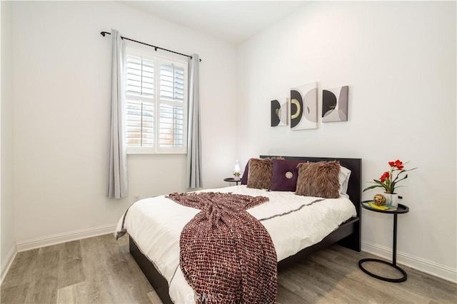 bedroom featuring hardwood / wood-style floors