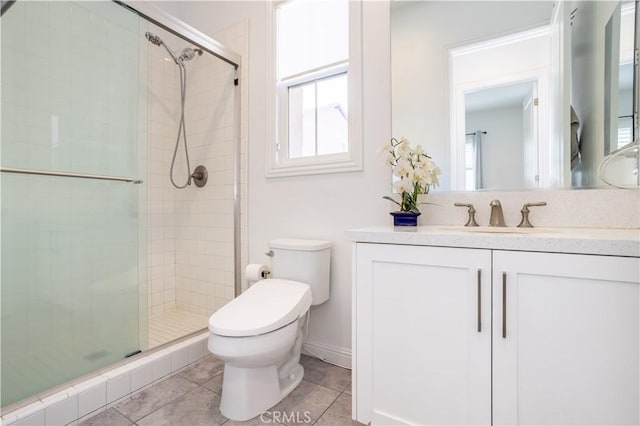 bathroom with tile patterned floors, vanity, toilet, and an enclosed shower