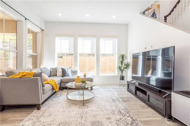 living room with a healthy amount of sunlight and light wood-type flooring