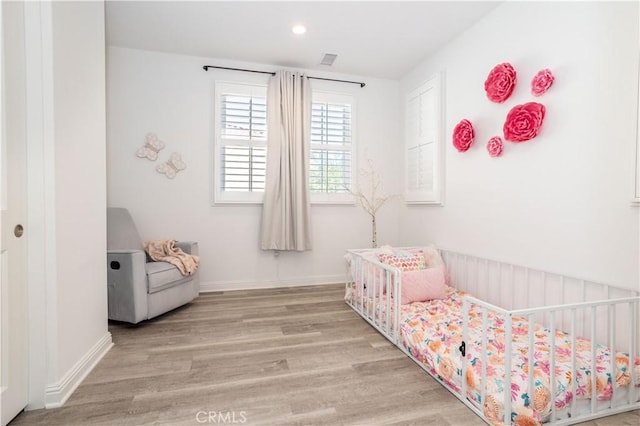 bedroom with light wood-type flooring