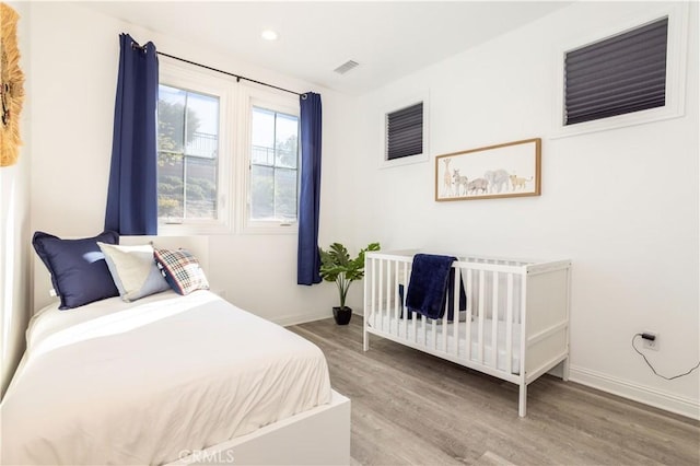 bedroom featuring light hardwood / wood-style floors