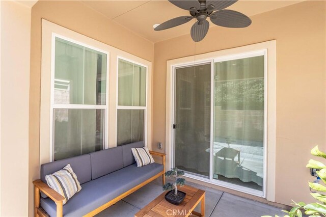 view of patio with ceiling fan and an outdoor hangout area