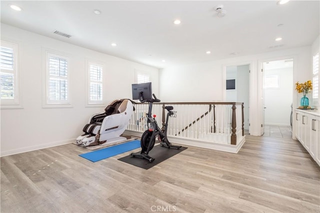 exercise area with light wood-type flooring