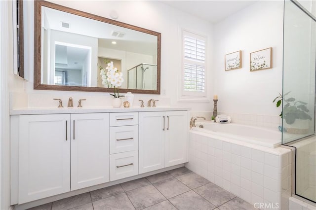 bathroom featuring vanity, separate shower and tub, and tile patterned flooring