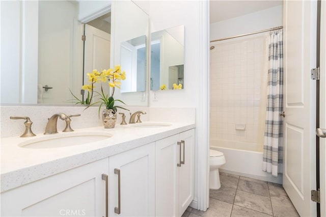 full bathroom featuring vanity, shower / bathtub combination with curtain, and toilet