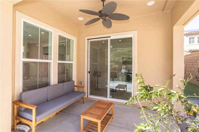 view of patio with ceiling fan and an outdoor living space