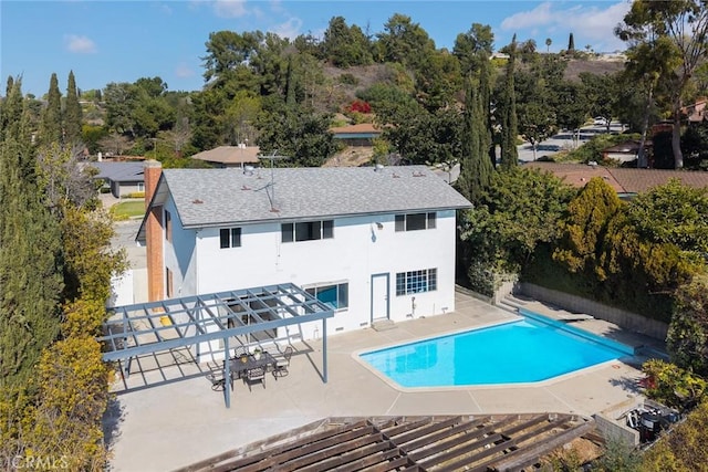 view of pool featuring a pergola, a diving board, and a patio