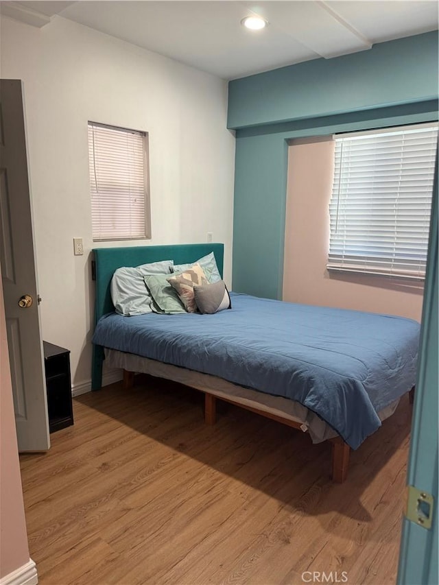 bedroom featuring wood-type flooring