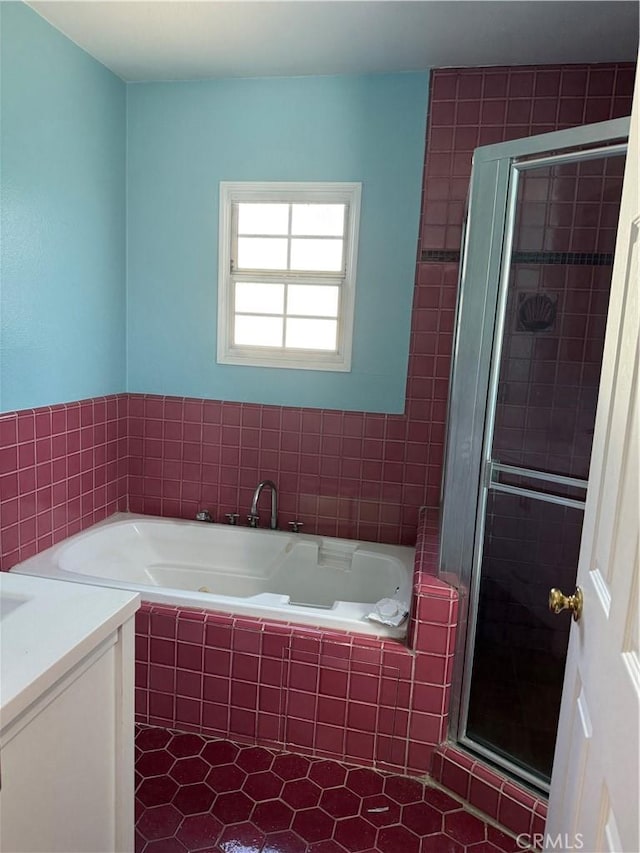 bathroom with vanity and separate shower and tub