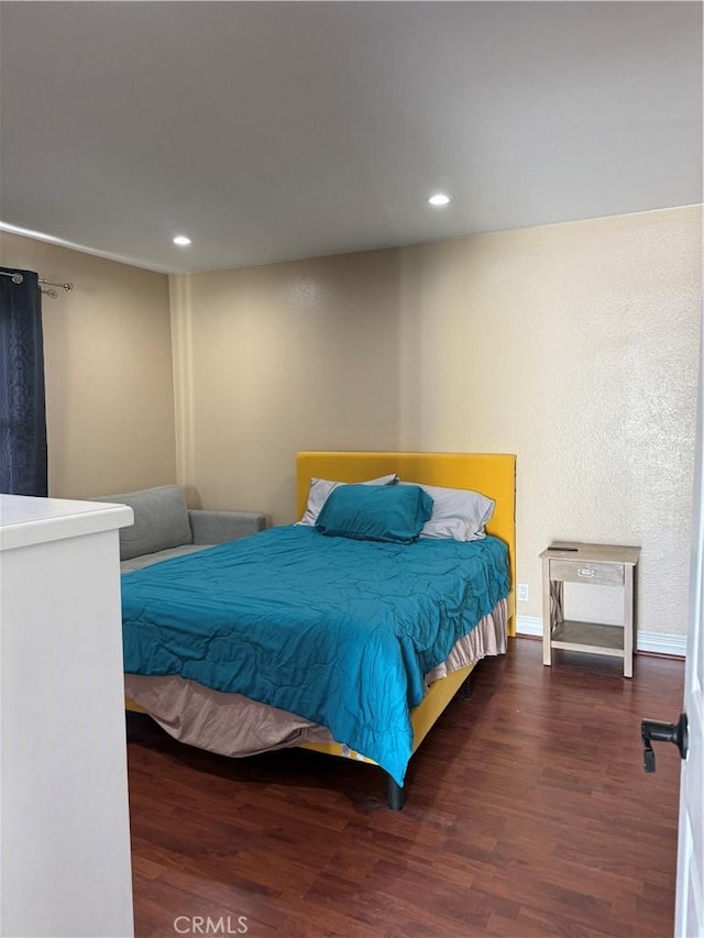 bedroom featuring dark wood-type flooring