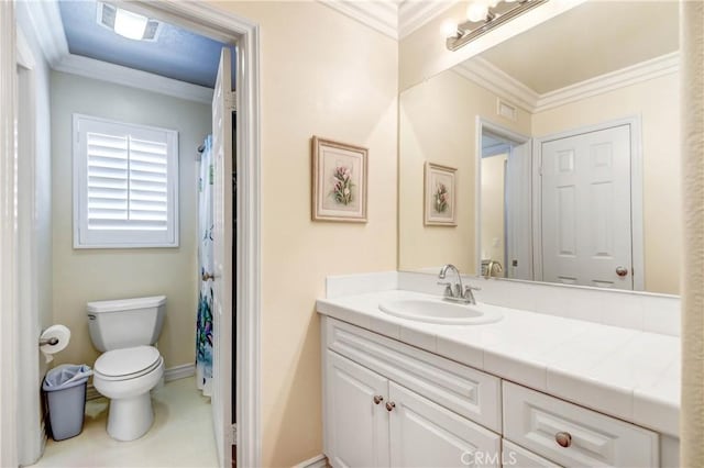 bathroom with vanity, ornamental molding, and toilet