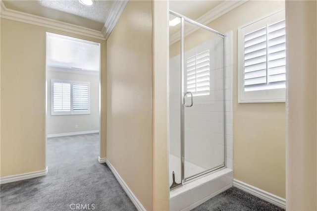 bathroom with ornamental molding and a shower with shower door