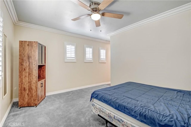 bedroom with crown molding, ceiling fan, and carpet