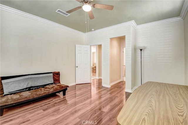 sitting room featuring crown molding, ceiling fan, and hardwood / wood-style floors