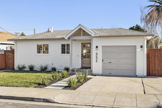 ranch-style house with a garage and a front lawn