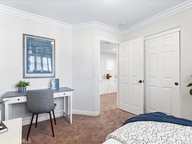 bedroom with ornamental molding and carpet floors