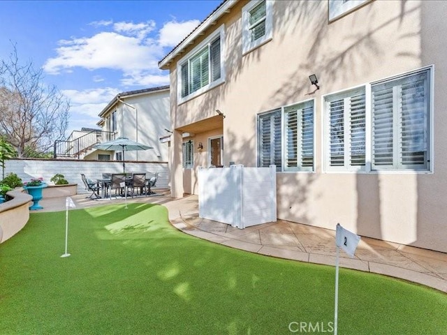 rear view of property with a patio area