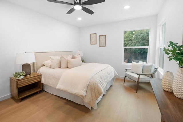 bedroom featuring wood-type flooring and ceiling fan