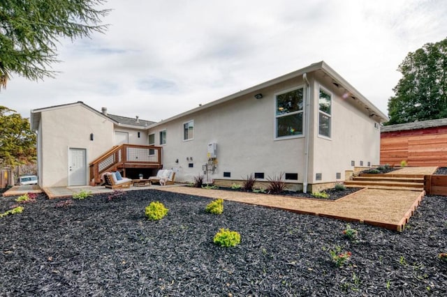 rear view of property featuring a patio