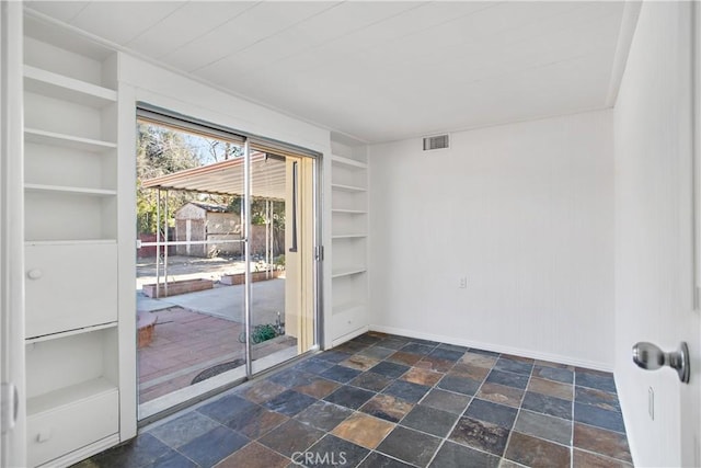 empty room with built in shelves