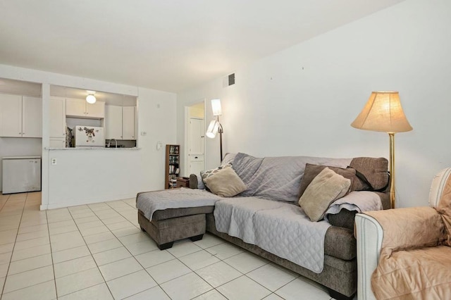 living room with light tile patterned floors