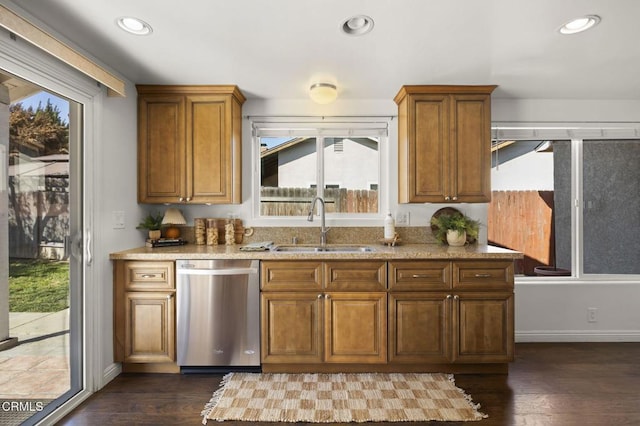 kitchen with dishwasher, sink, and dark hardwood / wood-style floors