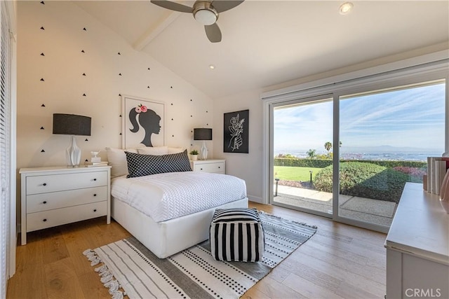 bedroom featuring lofted ceiling, access to exterior, ceiling fan, and light hardwood / wood-style flooring